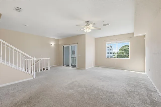 a view of kitchen with stainless steel appliances refrigerator and stove