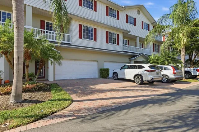a building outdoor space with a car parked in front of it
