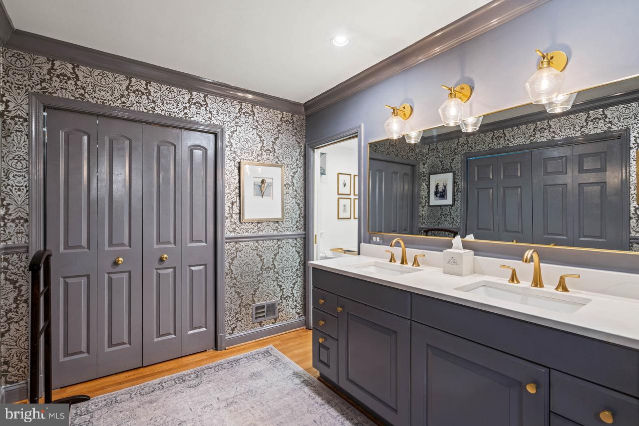 8 Farmington Court Chevy Chase, MD 20815 - Photo 20 of 34 a bathroom with a sink and a mirror