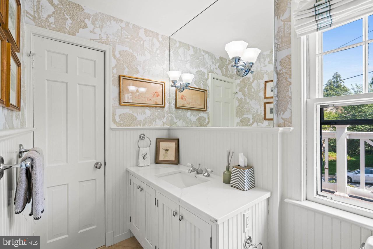 8 Farmington Court Chevy Chase, MD 20815 - Photo 23 of 34 a bathroom with a sink and a mirror