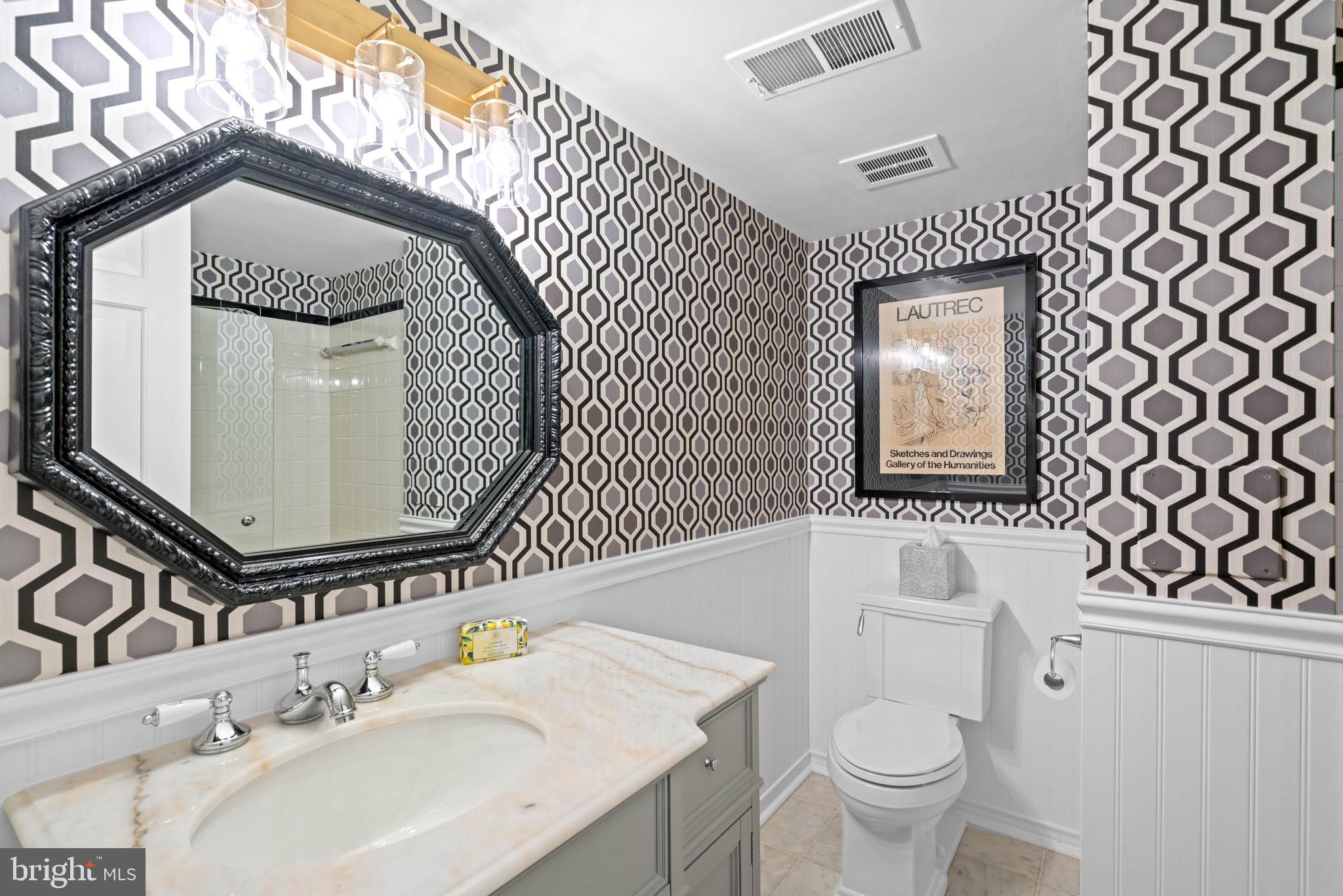 8 Farmington Court Chevy Chase, MD 20815 - Photo 30 of 34 a bathroom with a sink toilet and mirror