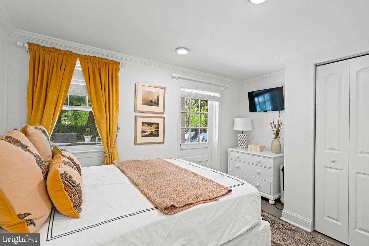 8 Farmington Court Chevy Chase, MD 20815 - Photo 31 of 34 a bedroom with a bed and glass windows