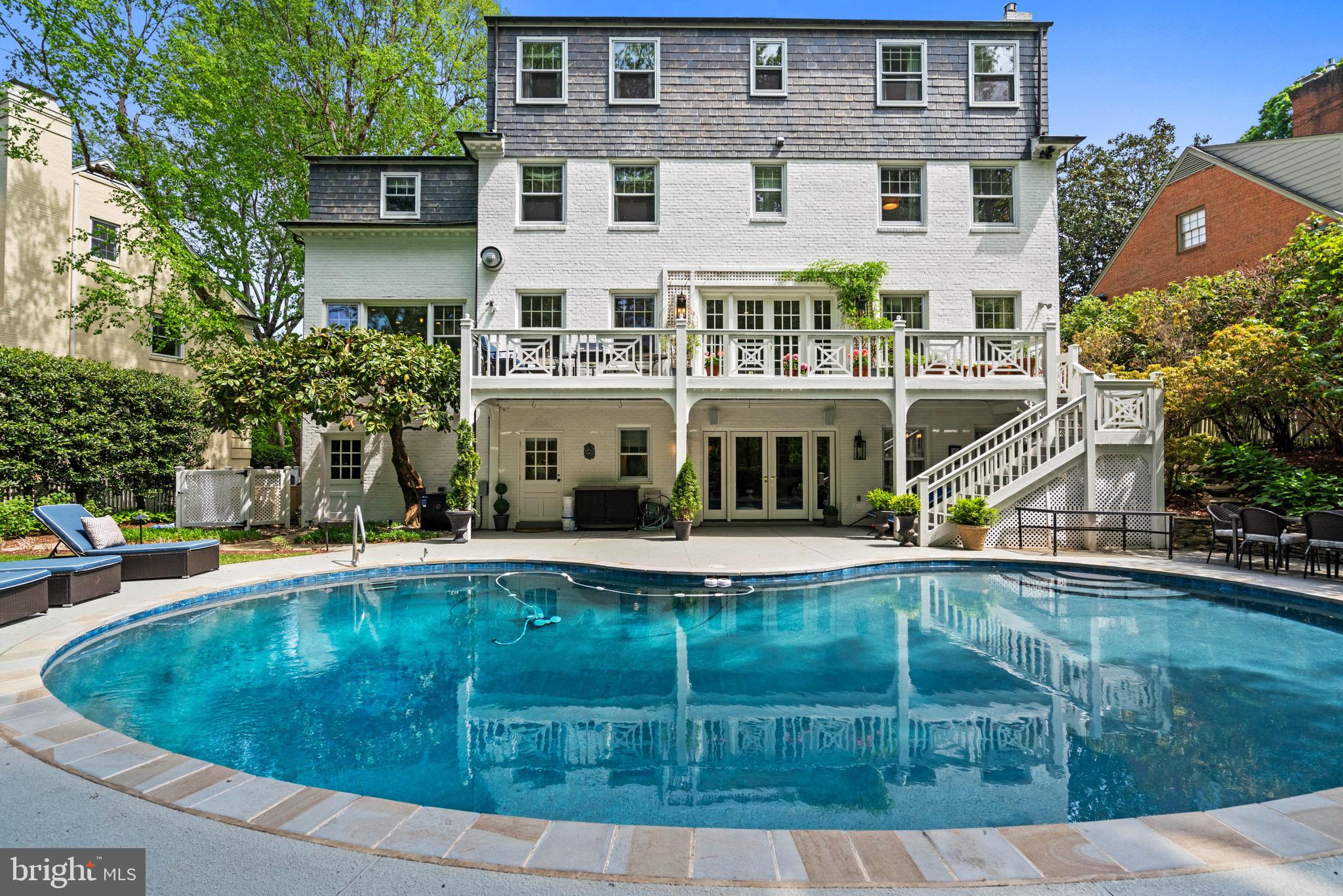 8 Farmington Court Chevy Chase, MD 20815 - Photo 34 of 34 a view of a house with pool and chairs