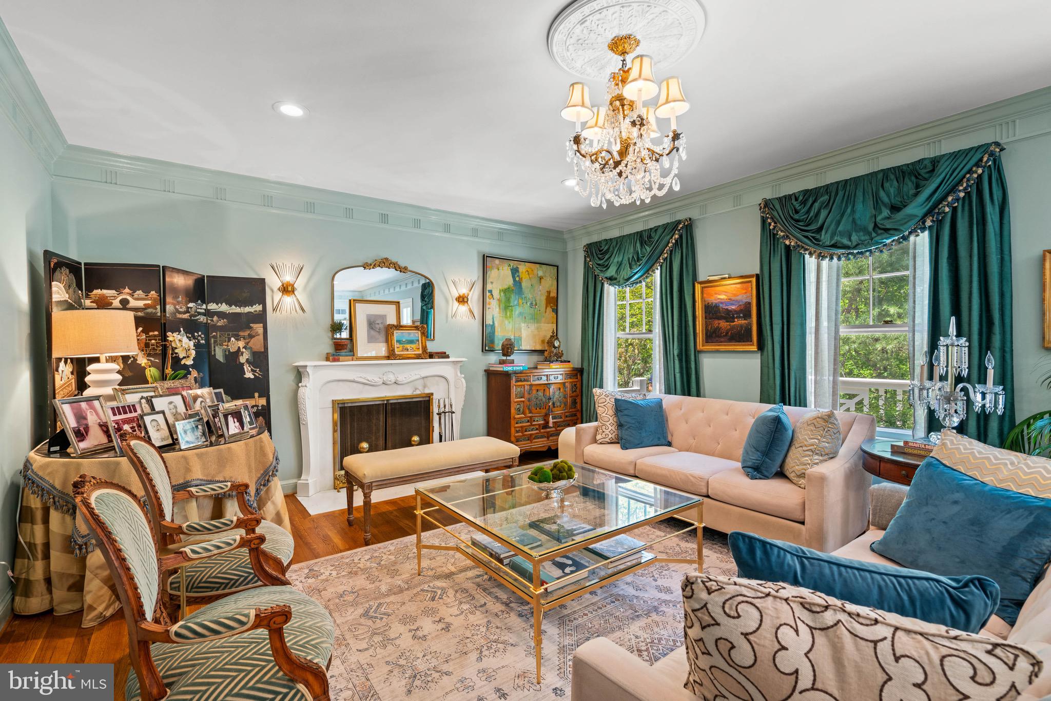 8 Farmington Court Chevy Chase, MD 20815 - Photo 8 of 34 a living room with fireplace furniture and a chandelier