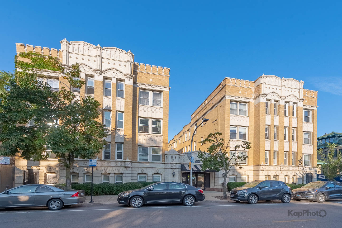 a view of a parked cars in front of a building