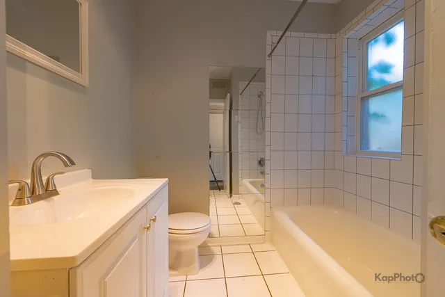 a bathroom with a bathtub and toilet