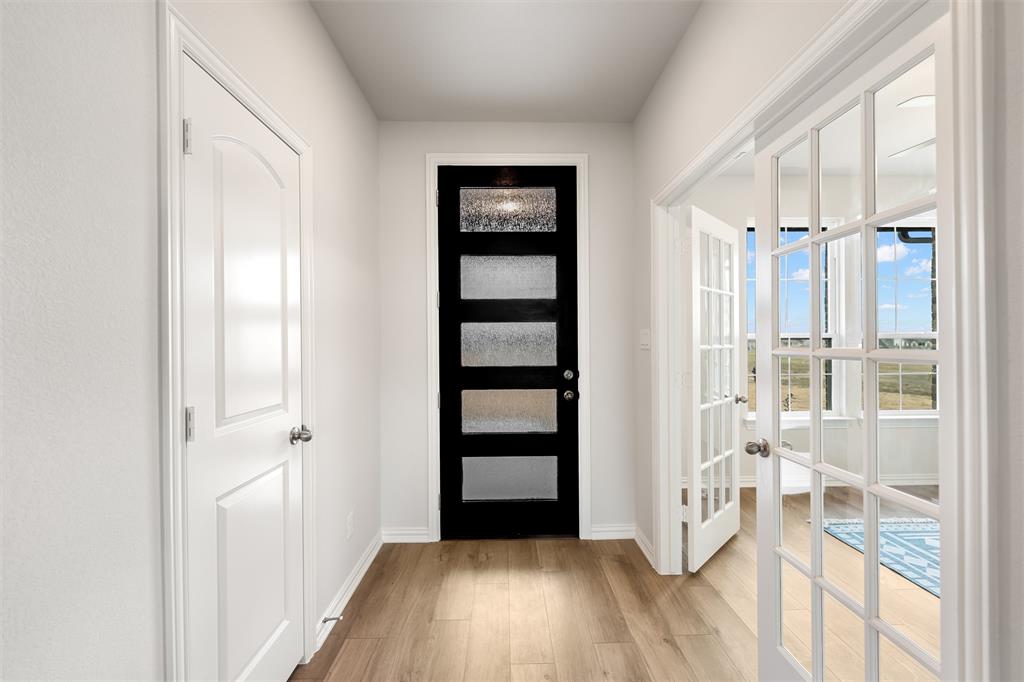 157 Brandywine Trail Rhome, TX 76078 - Photo 8 of 33 Entryway featuring light wood finished floors and french doors