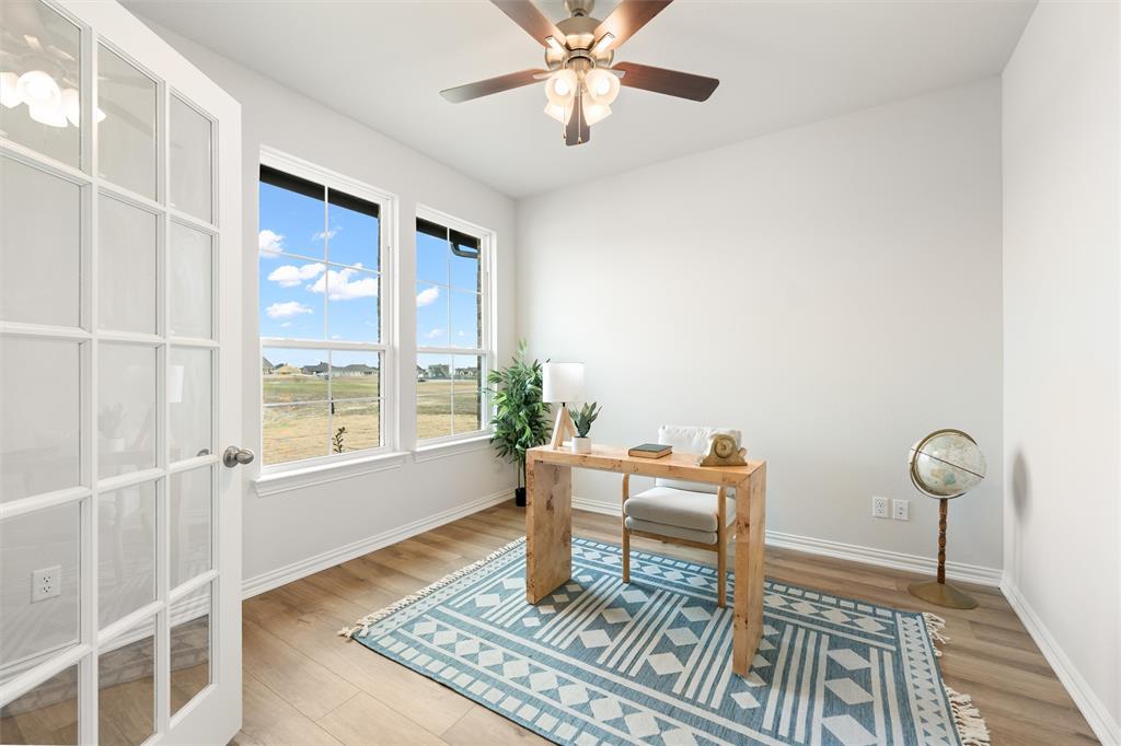 157 Brandywine Trail Rhome, TX 76078 - Photo 9 of 33 Office area featuring light wood-type flooring and ceiling fan