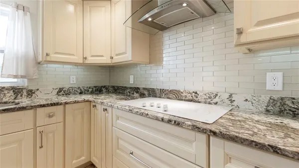 a bathroom with a sink and cabinets