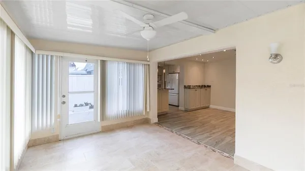 a view of an empty room with a cabinet