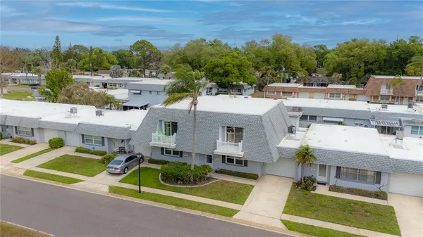 a view of a patio with couches table and chairs