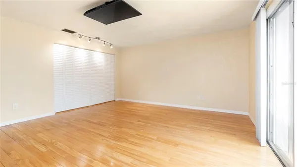 a view of empty room with ceiling fan