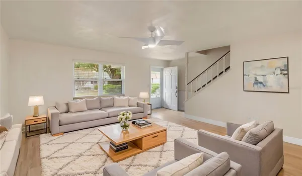 a living room with furniture and a window