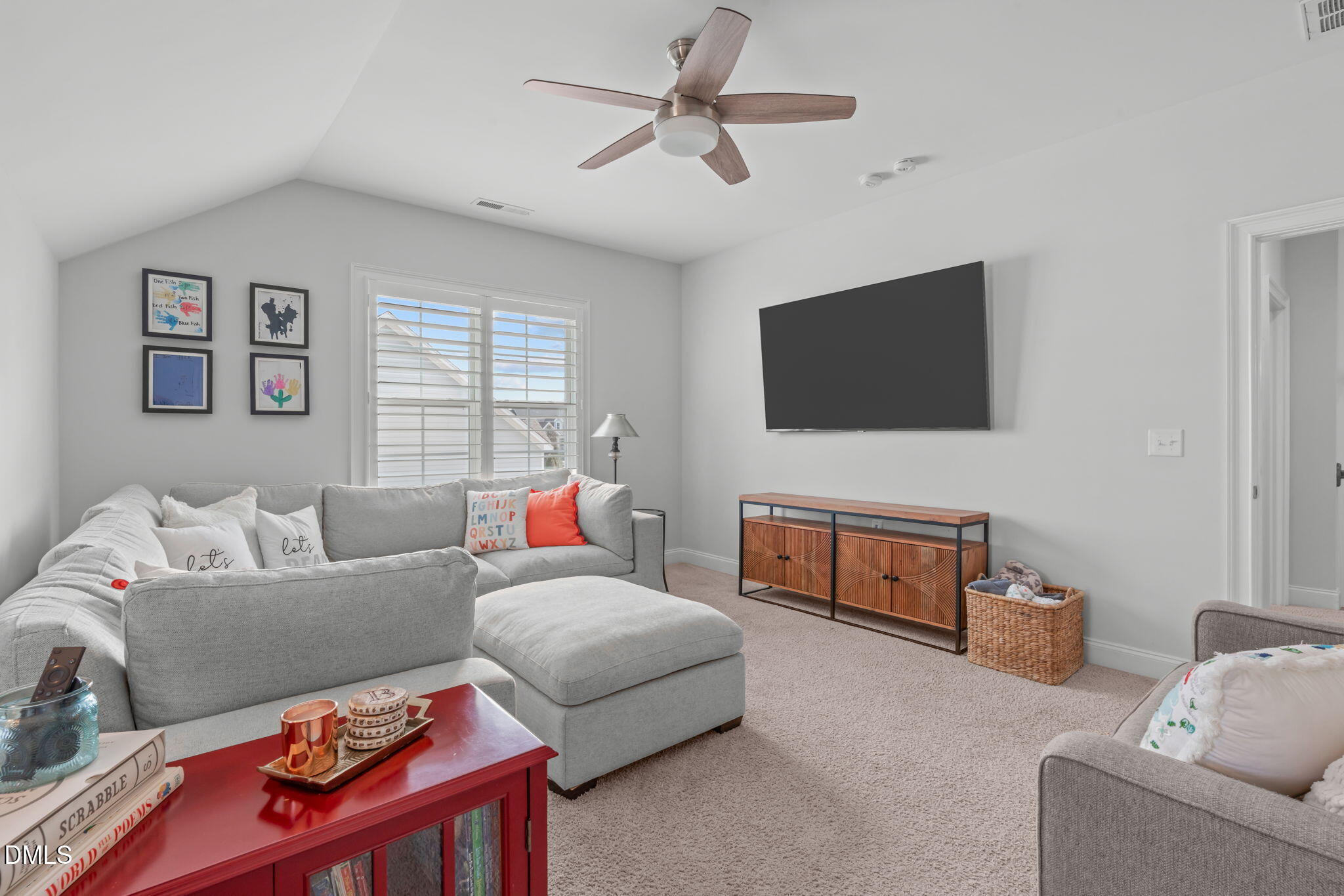 4144 Olde Judd Drive Willow Spring, NC 27592 - Photo 33 of 52 a living room with furniture and a flat screen tv