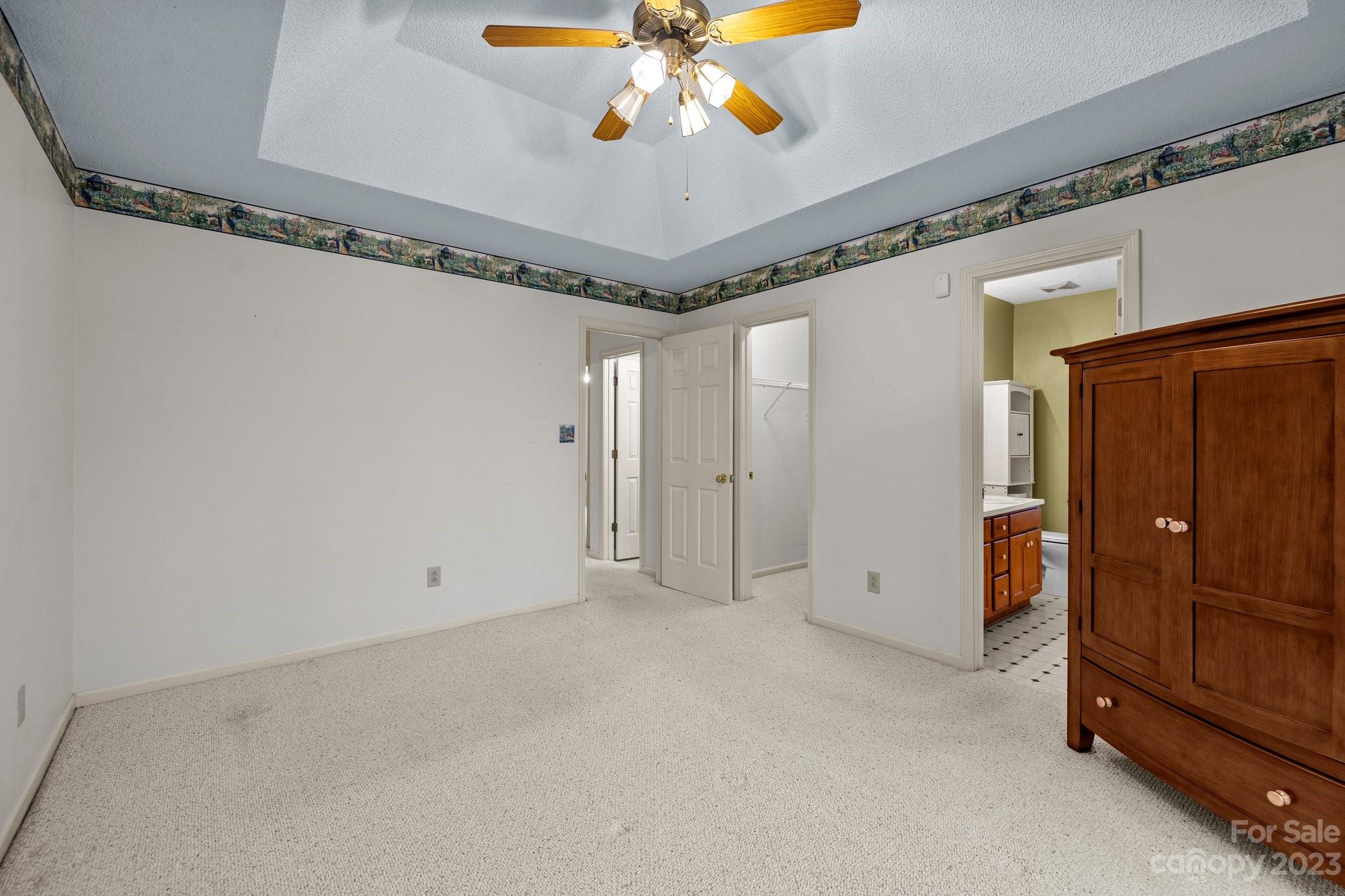 4445 Fawnbrook Avenue Southwest Concord, NC 28027 - Photo 13 of 27 a view of a livingroom with a ceiling fan and a chandelier