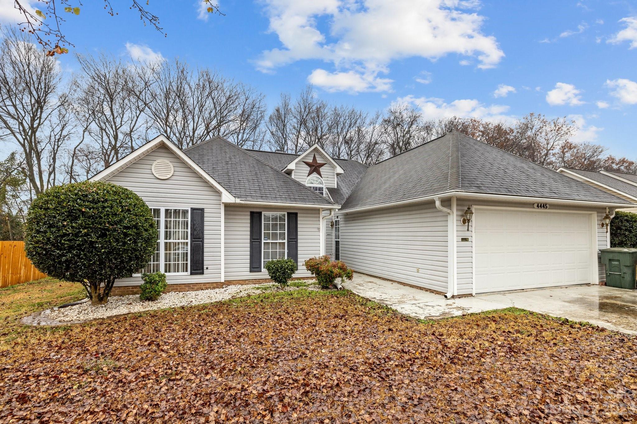 4445 Fawnbrook Avenue Southwest Concord, NC 28027 - Photo 2 of 27 a front view of a house with a yard and garage
