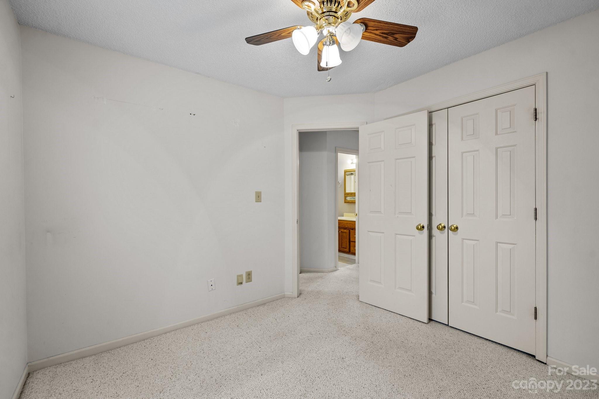 4445 Fawnbrook Avenue Southwest Concord, NC 28027 - Photo 21 of 27 an empty room with a chandelier fan