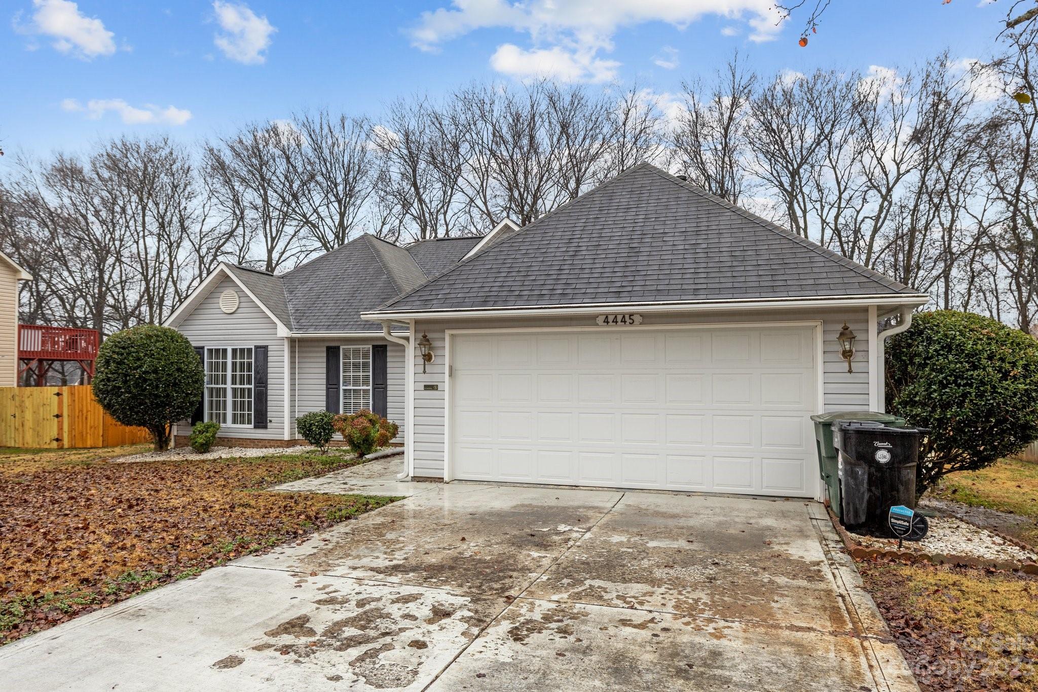 4445 Fawnbrook Avenue Southwest Concord, NC 28027 - Photo 27 of 27 a front view of a house with a yard and garage