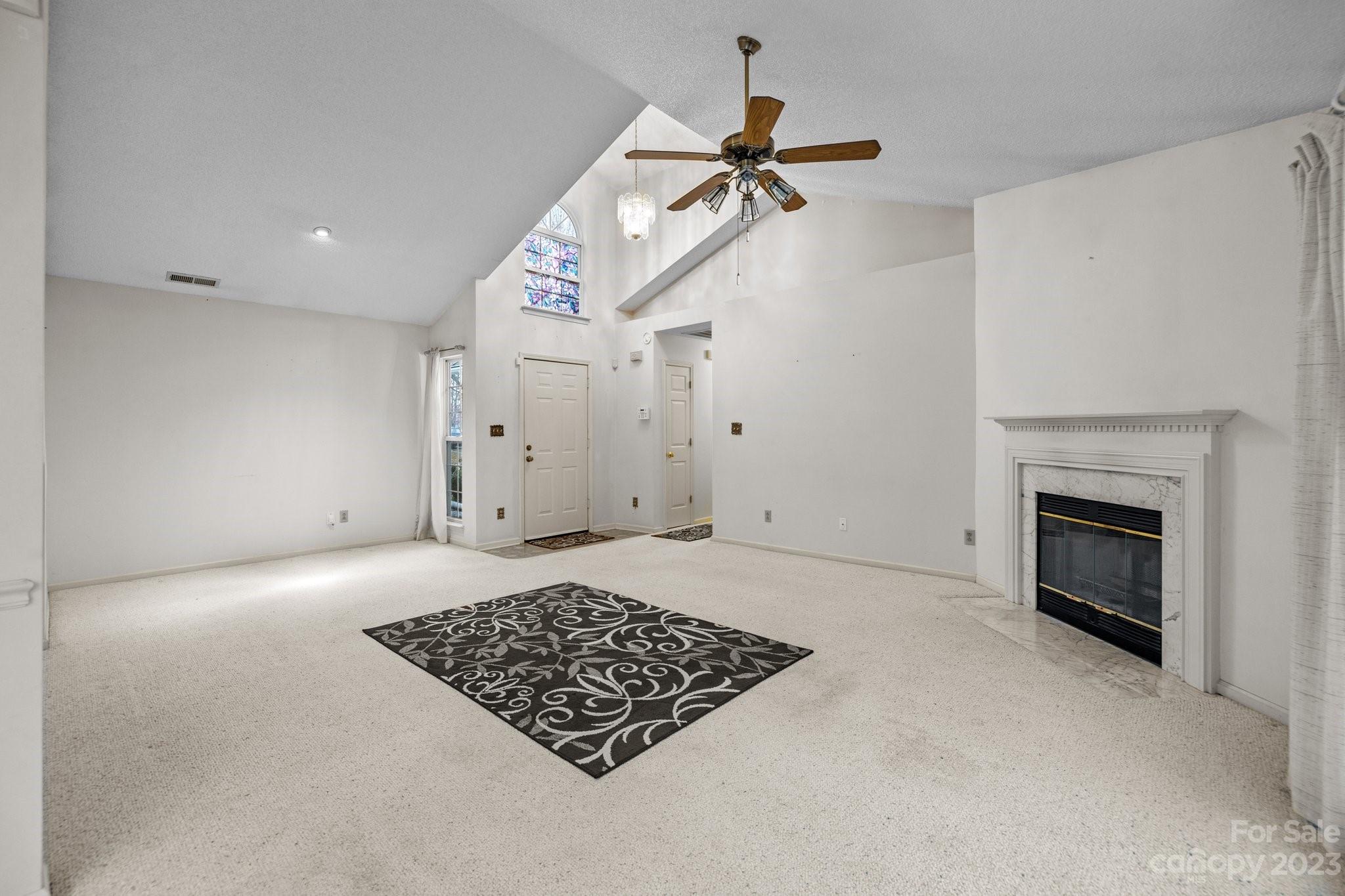 4445 Fawnbrook Avenue Southwest Concord, NC 28027 - Photo 3 of 27 a view of an empty room with a fireplace