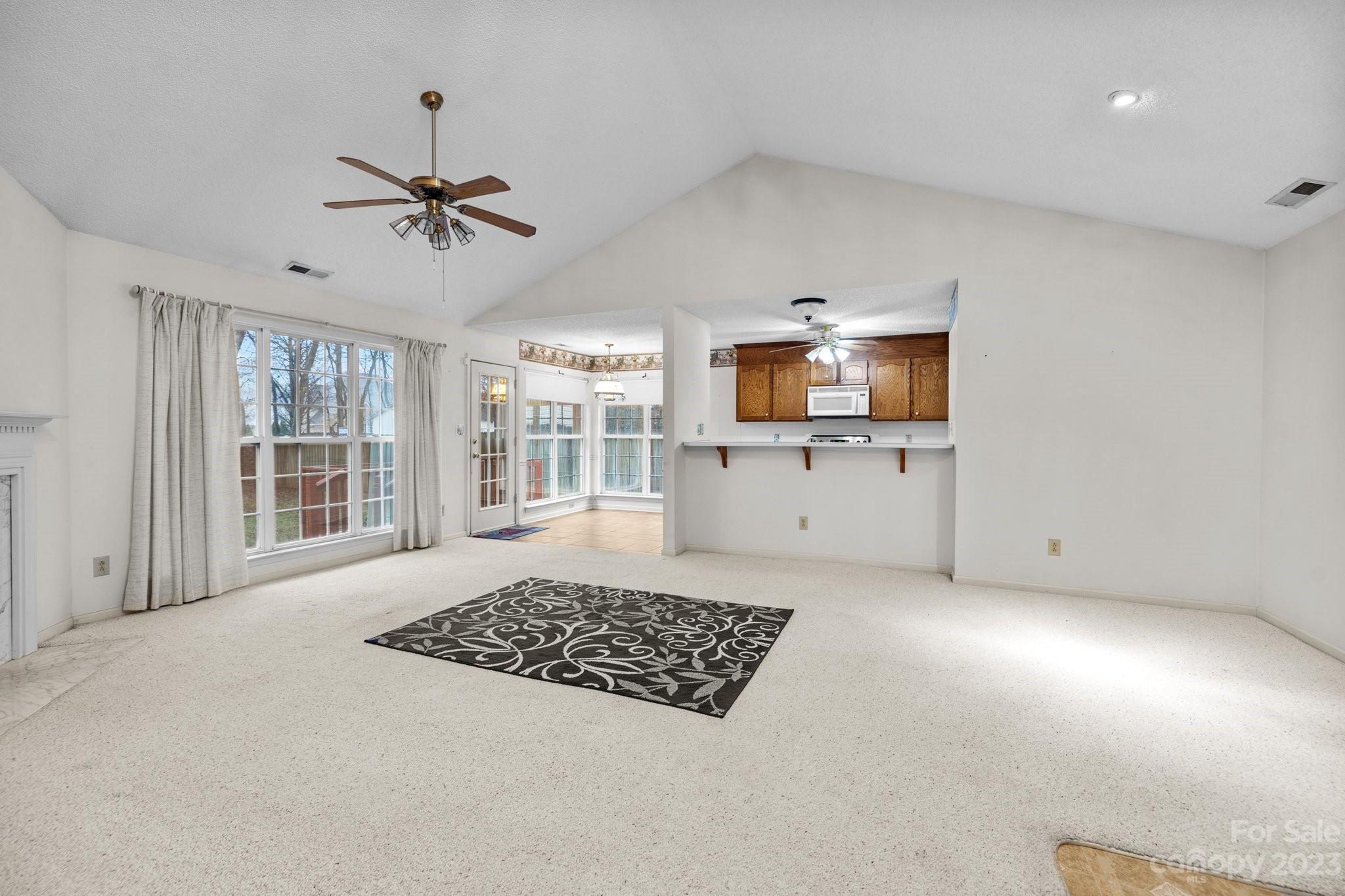 4445 Fawnbrook Avenue Southwest Concord, NC 28027 - Photo 5 of 27 a living room with furniture and a window