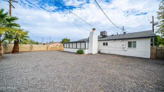 a kitchen with a refrigerator sink and cabinets