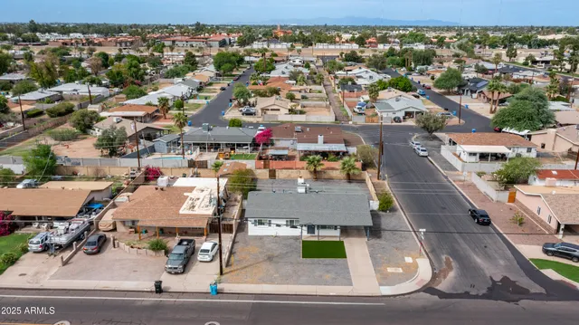 an aerial view of residential houses with outdoor space