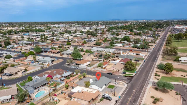an aerial view of residential houses with outdoor space