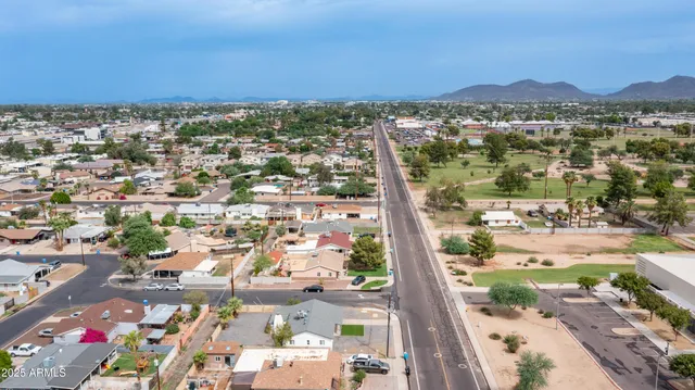 an aerial view of residential building and lake
