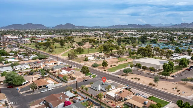 an aerial view of residential building and lake