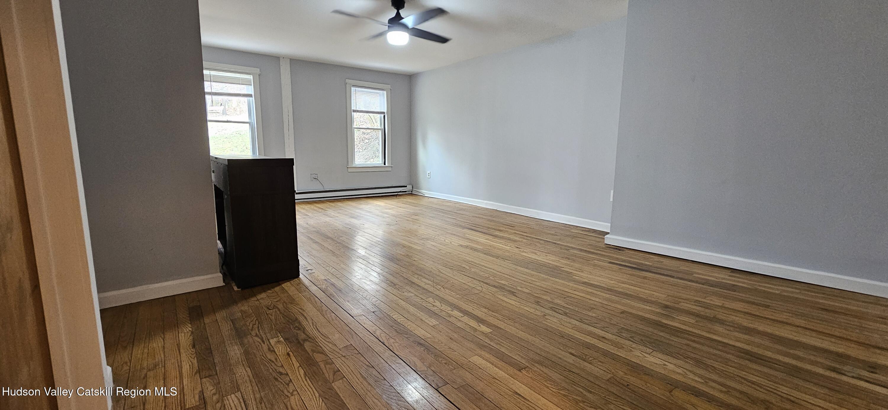 22 Spring Street Chatham, NY 12037 - Photo 16 of 61 wooden floor in an empty room with a window