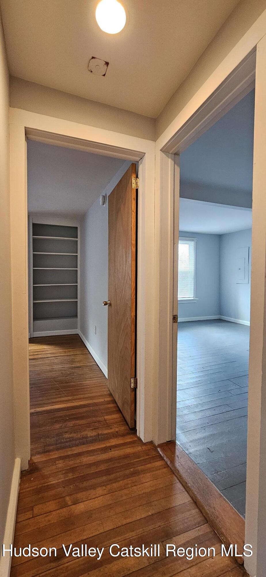 22 Spring Street Chatham, NY 12037 - Photo 17 of 61 a view of a hallway with wooden floor and closet