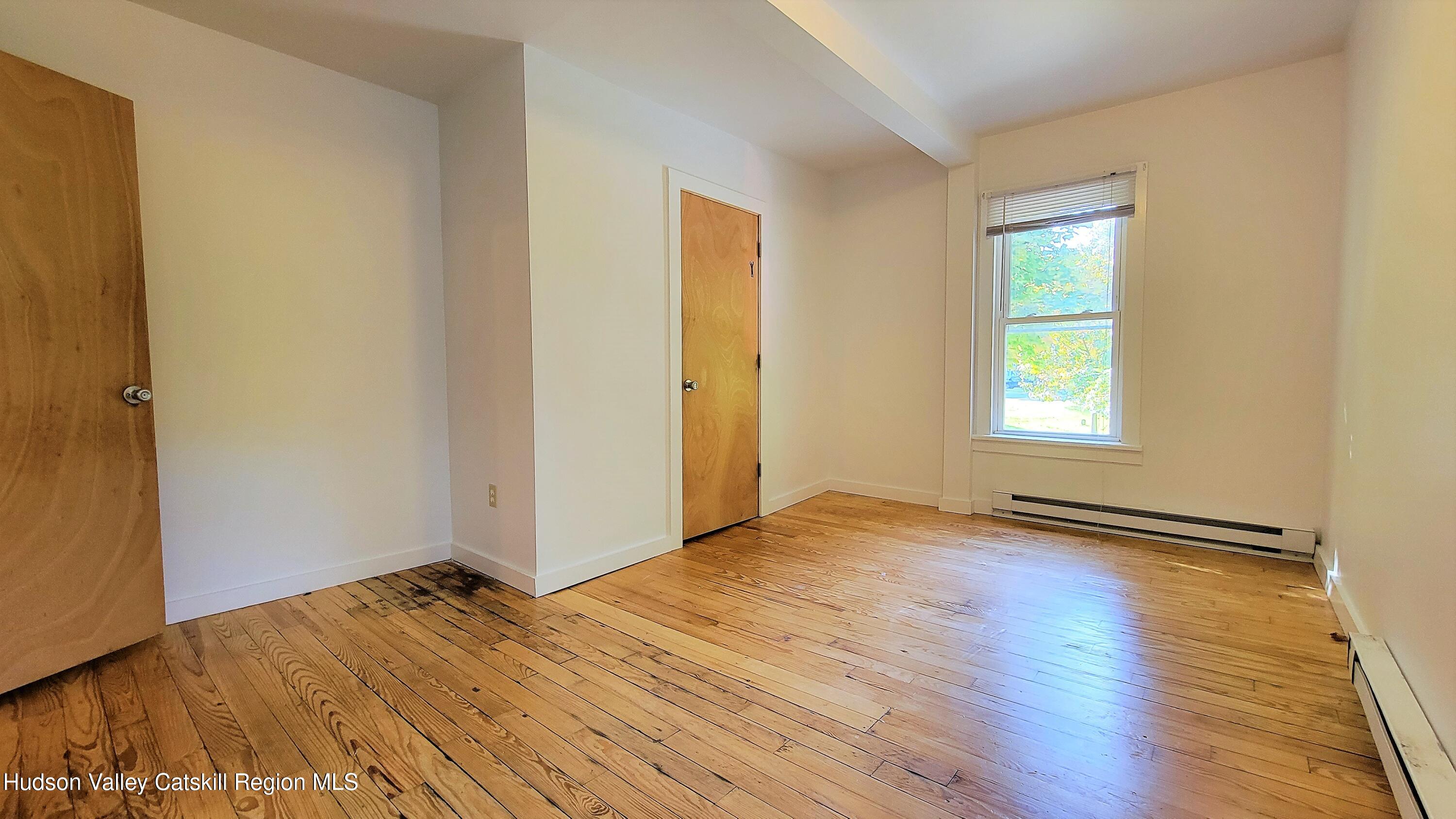 22 Spring Street Chatham, NY 12037 - Photo 24 of 61 a view of empty room with wooden floor and fan