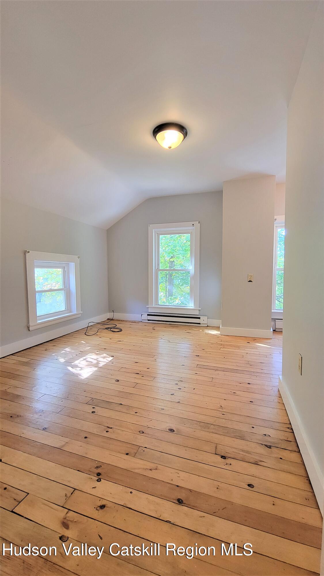 22 Spring Street Chatham, NY 12037 - Photo 43 of 61 a view of empty room with wooden floor
