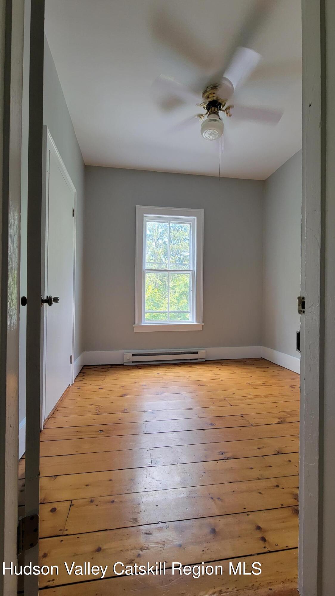 22 Spring Street Chatham, NY 12037 - Photo 56 of 61 wooden floor in an empty room