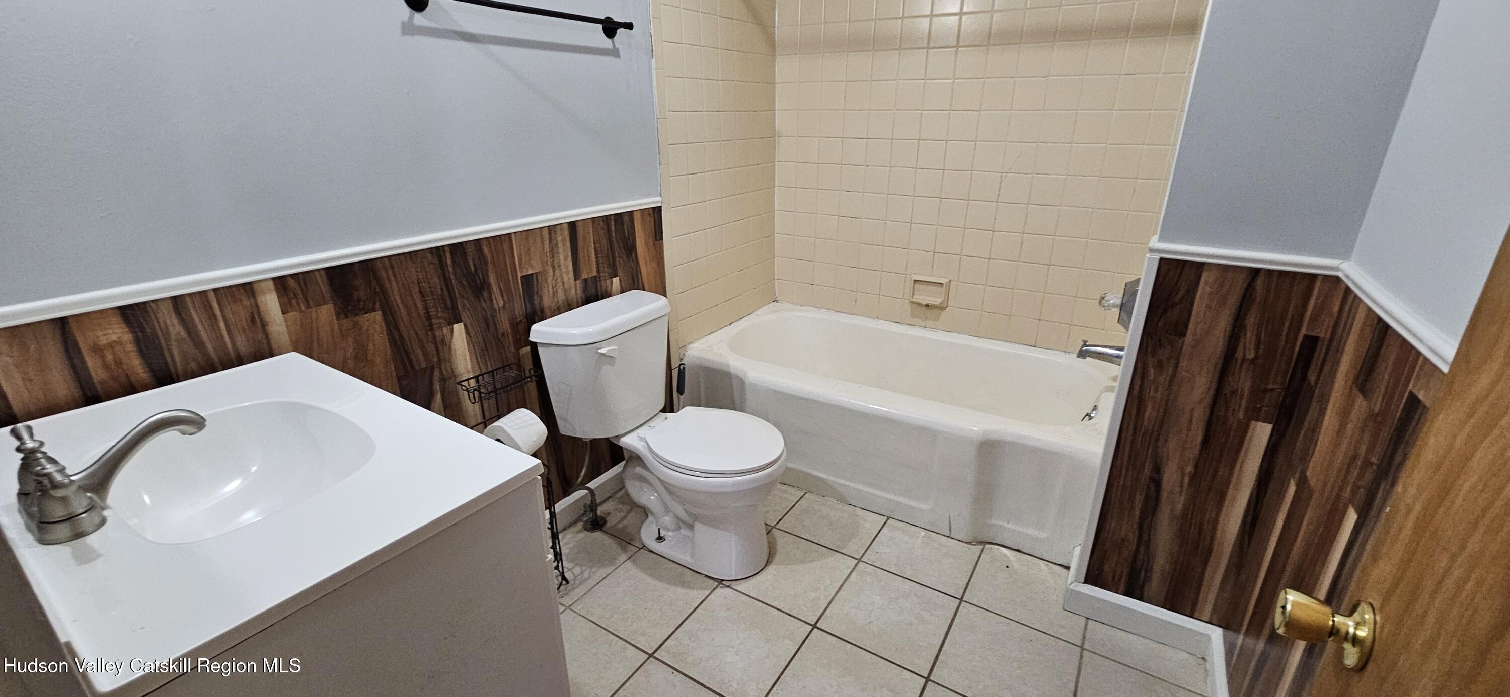 22 Spring Street Chatham, NY 12037 - Photo 10 of 61 a bathroom with a sink a toilet and bathtub