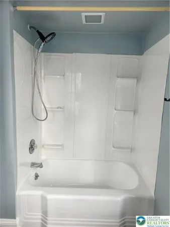 a bathroom with a bath tub