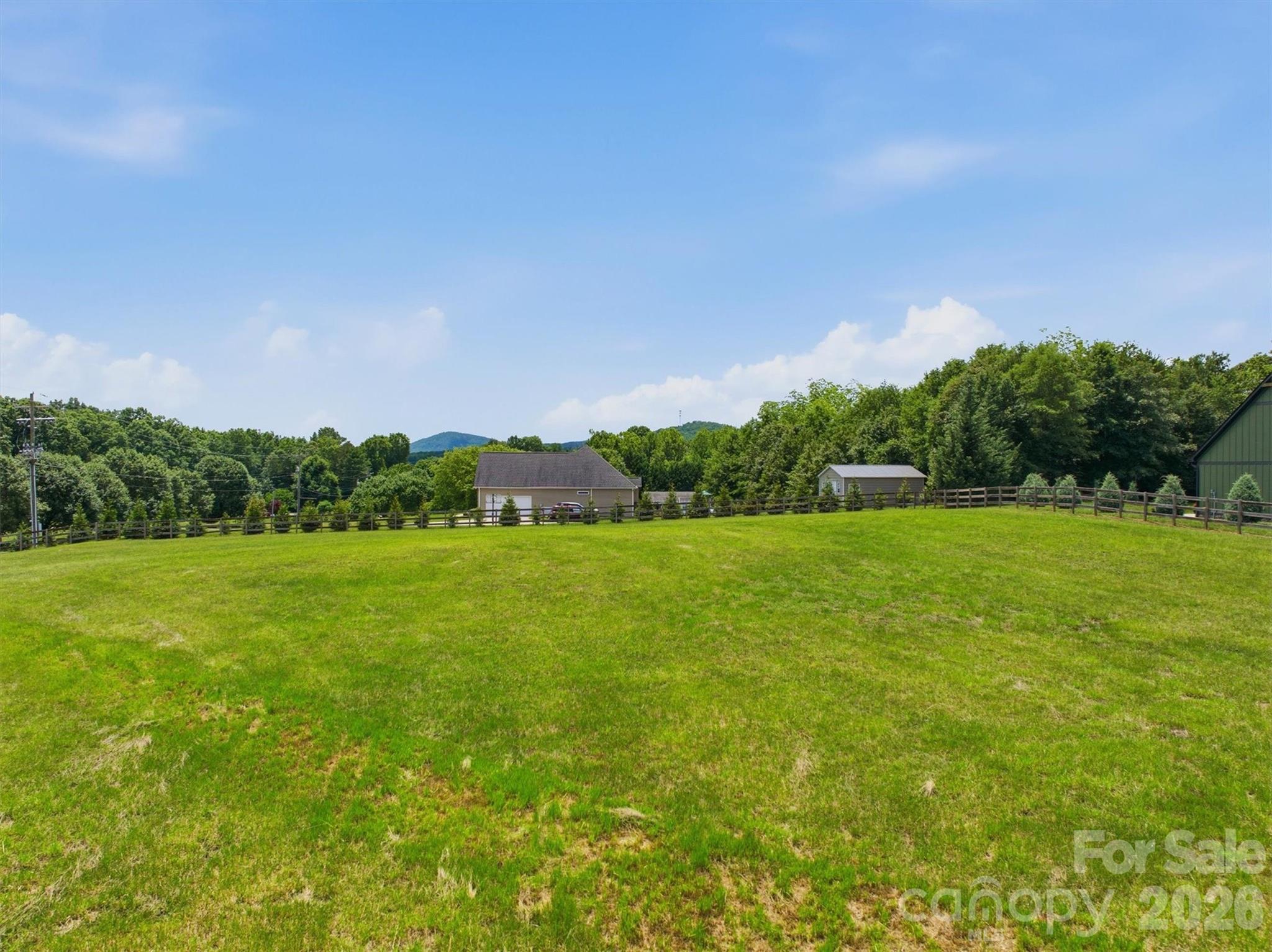 7490 Oak Ridge Church Road Connelly Springs, NC 28612 - Photo 36 of 44 a view of a green field with clear sky