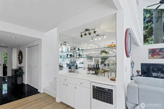 a living room with fireplace furniture and decor