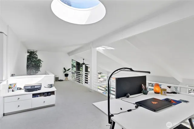 a workspace with furniture and mirror