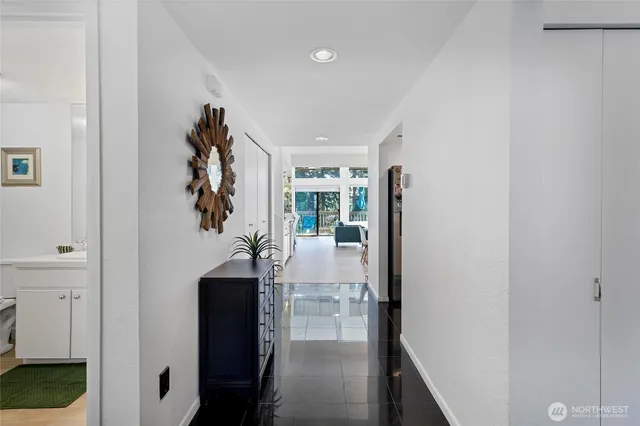 a view of entryway and hall with a dining table