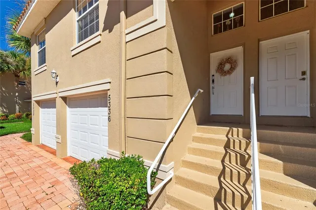 a view of a house with a door and a window