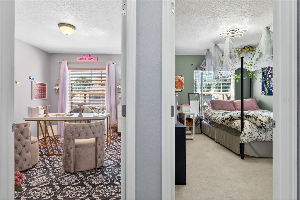 5336 Edgewater Way Oxford, FL 34484 - Photo 22 of 45 a bedroom with a bed and a window