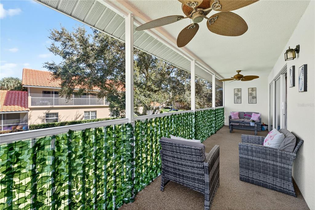 5336 Edgewater Way Oxford, FL 34484 - Photo 25 of 45 a view of a porch with furniture and garden