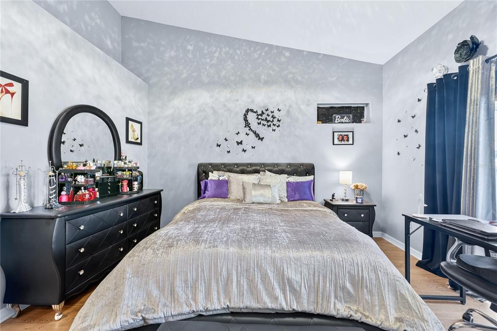 5336 Edgewater Way Oxford, FL 34484 - Photo 27 of 45 a bedroom with a bed and a dresser