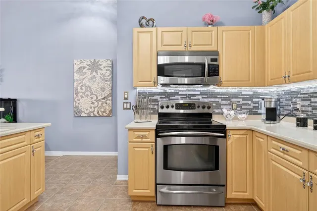 a living room with kitchen island granite countertop furniture and a fireplace