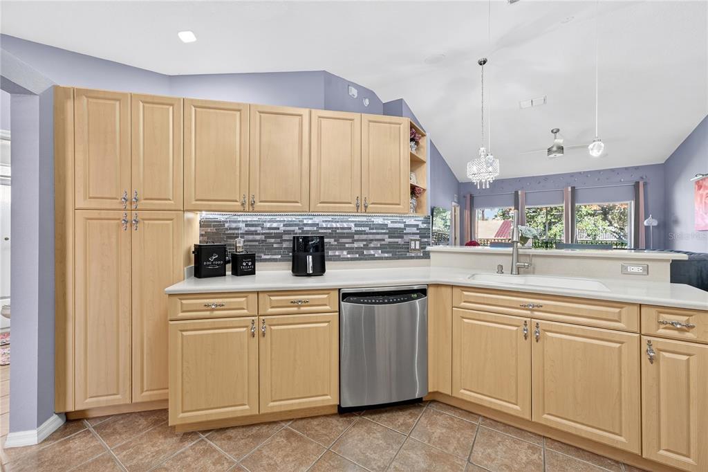 5336 Edgewater Way Oxford, FL 34484 - Photo 39 of 45 a kitchen with white cabinets and white appliances