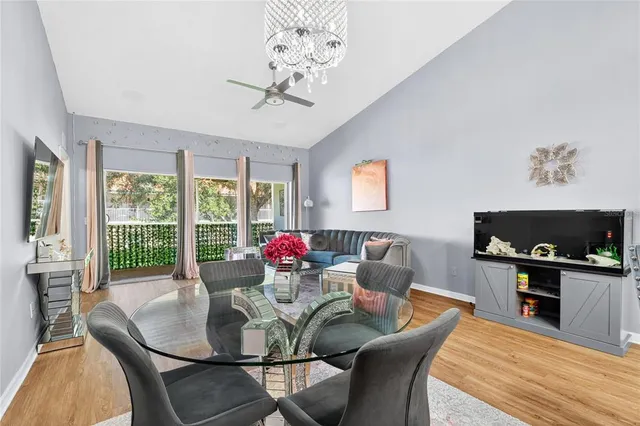 a view of a dining room with furniture window and outside view