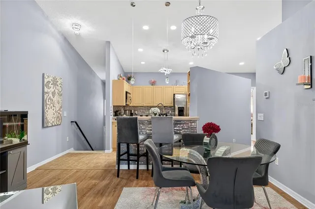 a very nice looking dining room with a table and chairs