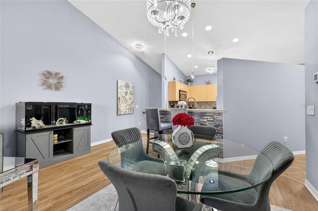 5336 Edgewater Way Oxford, FL 34484 - Photo 9 of 45 a living room with furniture and kitchen view