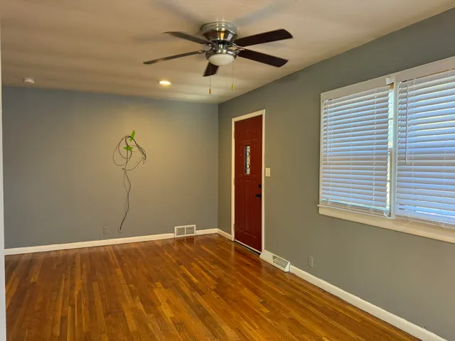 a view of an empty room with a window